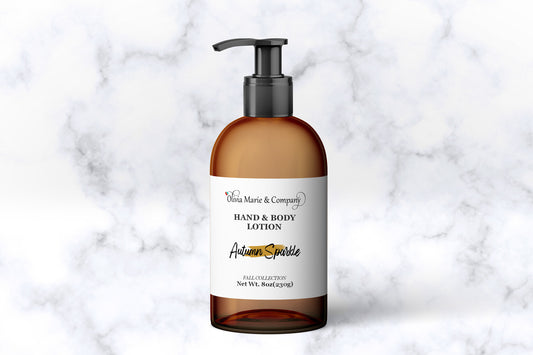 Hand and body lotion bottle labeled 'Autumn Sprinkle' on a marble background
