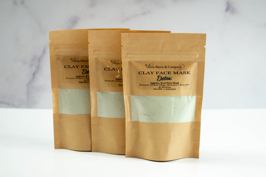 Green clay mask in brown bag with see through window.