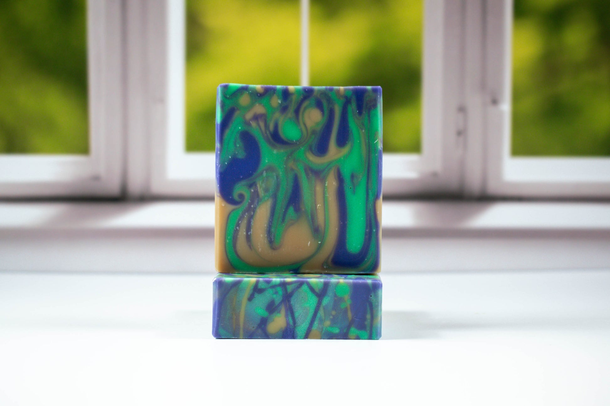 Swirl soap with the colors blue, green, and yellow.