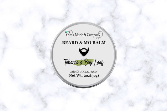 Tin container with beard balm label in Tobacco and Bay Leaf.