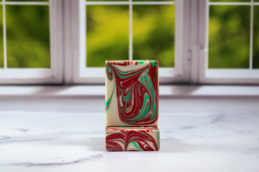 Apple Harvest soap with red and green swirls on a white background.