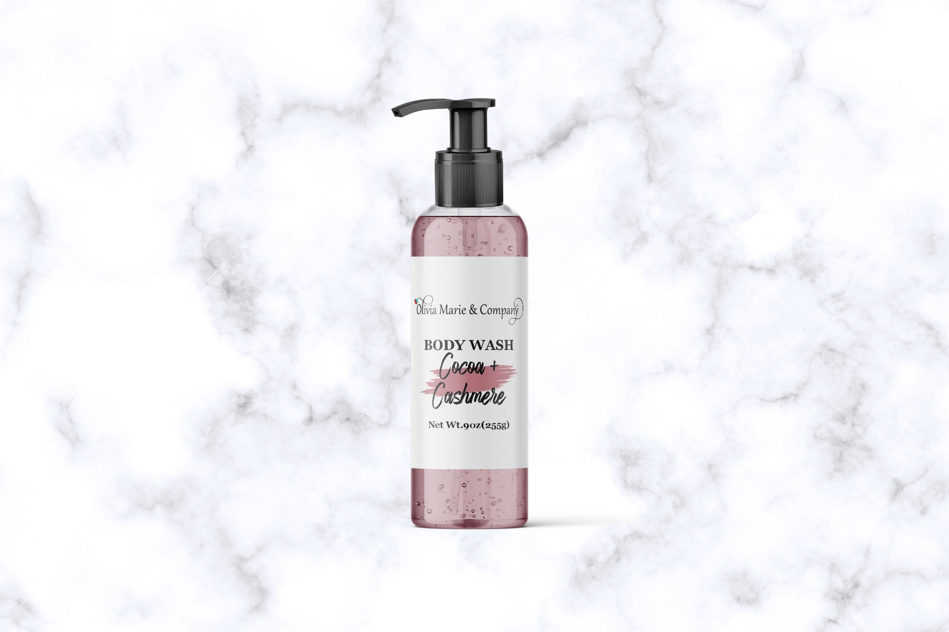Cocoa Butter Cashmere body wash in a clear bottle with a rose pink color liquid.
