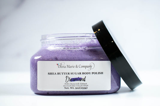 Dreamland sugar scrub colored purple in a clear jar.