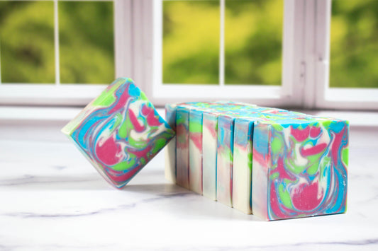 A picture of flamingo zest soap with colors of pink, blue, green, and white swirled together