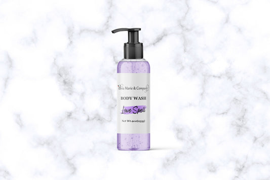 love spell body wash with a light purple liquid in a clear bottle.