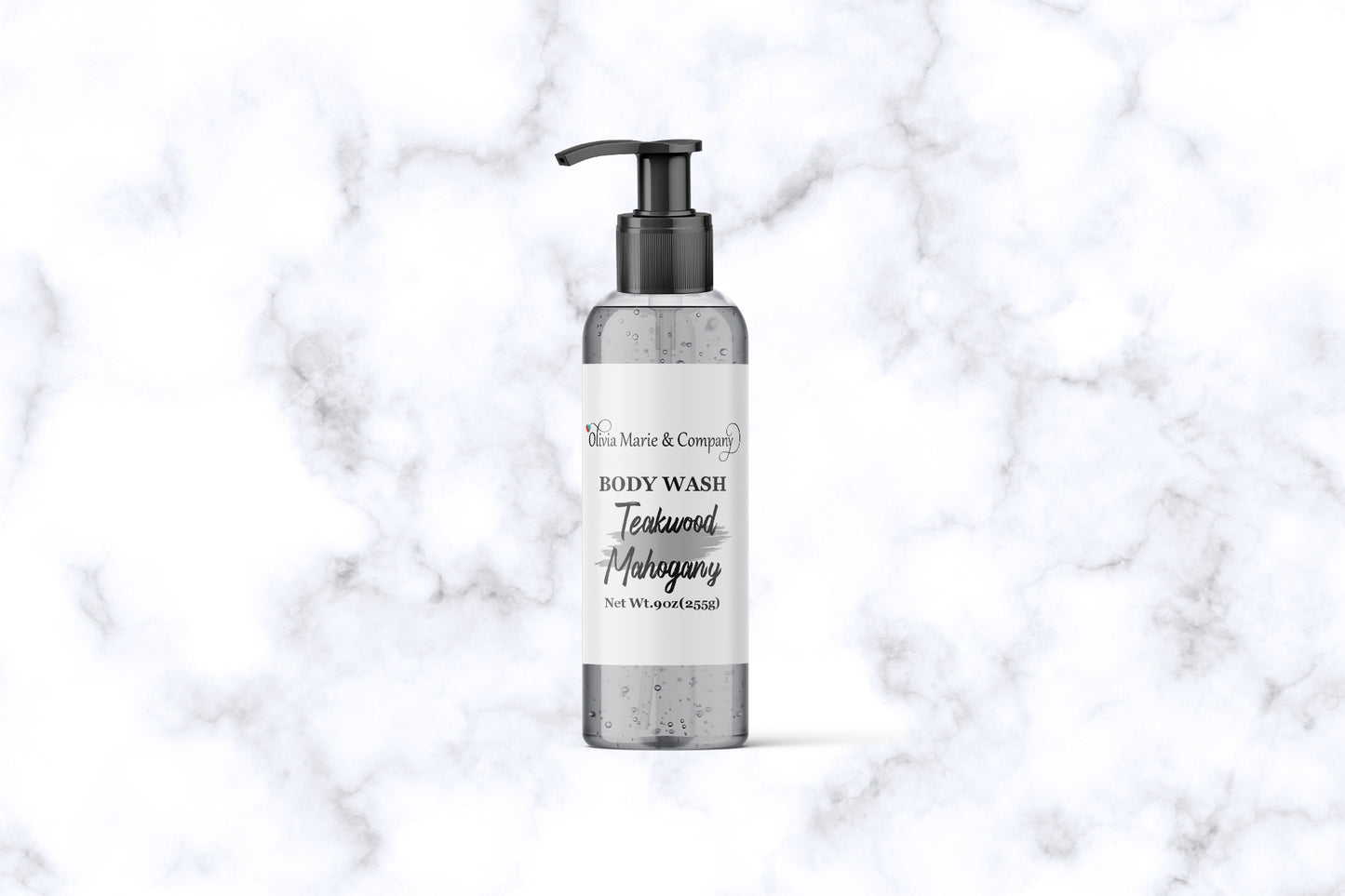 Mahogany teakwood body wash in a clear bottle with a gray liquid.